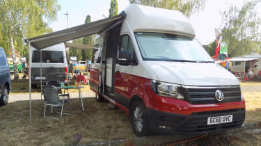 Volkswagen Grand California parked in campsite